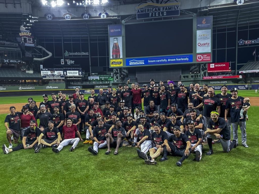 The Arizona Diamondbacks pose for a picture after Game 2 of their National League wildcard baseball series against the Milwaukee Brewers Wednesday, Oct. 4, 2023, in Milwaukee. The Diamondbacks won 5-2 to win the series. (AP Photo/Morry Gash)