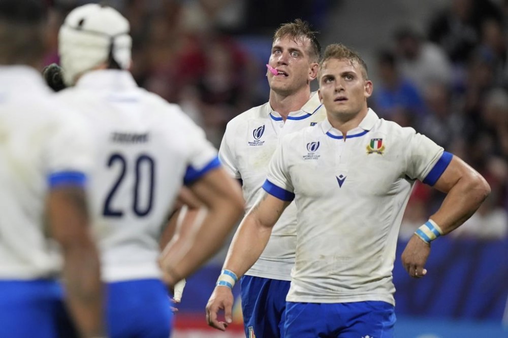 Italy's players react after New Zealand scored a try during the Rugby World Cup Pool A match between New Zealand and Italy at the OL Stadium in Lyon, France, Friday, Sept. 29, 2023. (AP Photo/Pavel Golovkin)