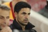 Arsenal's manager Mikel Arteta sits on the bench during the English League Cup third round soccer match between Brentford and Arsenal at the Gtech Community Stadium, in London Wednesday, Sept. 27, 2023. (AP Photo/Ian Walton)