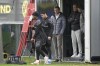 Dortmund's head coach Edin Terzic, Dortmund CEO Hans-Joachim Watzke and his son Andre Watzke, from right, watching Dortmund's Giovanni Reyna walking on the pitch during a training session prior to the UEFA Champions League Group F soccer match between Borussia Dortmund and AC Milan in Dortmund, Germany, Tuesday, Oct. 3, 2023. (AP Photo/Martin Meissner)