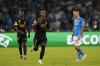 Napoli's Matteo Politano, right, watches as Real Madrid's Vinicius Junior celebrates after scoring his sides first goal during the Champions League group C soccer match between Napoli and Real Madrid at the Diego Armando Maradona stadium in Naples, Italy, Tuesday, Oct. 3, 2023. (AP Photo/Alessandra Tarantino)