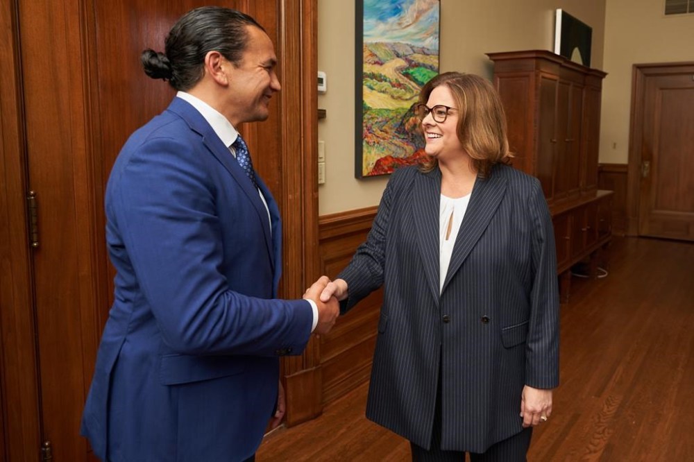 Manitoba premier-designate Wab Kinew, left, meets with outgoing Manitoba Premier Heather Stefanson in the premier's office in Winnipeg, Thursday, Oct. 5, 2023. Elections Manitoba says unofficial results from Tuesday's election show Stefanson narrowly hung on to her legislature seat for the Progressive Conservatives. THE CANADIAN PRESS/David Lipnowski