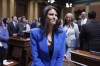 FILE - Michigan Attorney General Dana Nessel walks to her seat before the State of the State address, Jan. 25, 2023, at the state Capitol in Lansing, Mich. A Michigan judge is expected to decide Friday morning, Oct. 6, whether to drop charges against two defendants accused of participating in a fake elector scheme after the state attorney general said the group was “brainwashed” into believing former President Donald Trump had won the 2020 election. (AP Photo/Al Goldis, File)