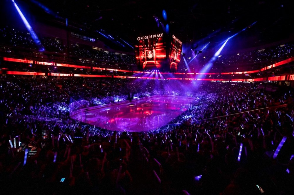 Fans cheer during an opening ceremony before NHL hockey action between the Vancouver Canucks and Edmonton Oilers in Edmonton on October 12, 2022. Canada's federal government legalized single-game sports betting in August 2021, allowing people to gamble on the outcome of just one game instead of in a parlay format involving at least three teams. The goal was to take back control of a roughly-$10 billion a year industry where betting on single sporting events was conducted through the black market by organized criminal networks. Since then, provinces and their respective lottery corporations have reported a substantial increase in revenue. THE CANADIAN PRESS/Jason Franson