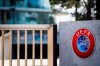 FILE - The UEFA logo displayed to the entrance of the UEFA Headquarters, in Nyon, Switzerland, Tuesday, March 17, 2020. UEFA’s decision to welcome Russian youth teams back into its competitions has cost its Swedish vice president his other top-tier job as head of a national sports body. Karl-Erik Nilsson has on Friday, Oct. 6, 2024 resigned as chairman of the Swedish Sports Confederation. (Jean-Christophe Bott/Keystone via AP)