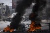 Israeli border police blocks the roads and clash with Palestinian protesters during the funeral of Labeeb Dumaidi, 19 in the West Bank village of Hawara, near Nablus, Friday, Oct. 6, 2023. The teenager's death, coming as tensions escalate during the Jewish holiday season, marked the latest incident a surge of Israeli-Palestinian fighting. (AP Photo/Nasser Nasser)