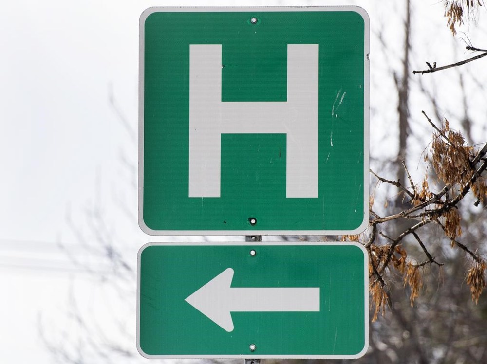 A hospital network in central Ontario says it is seeing patient volumes surge to as high as 150 per cent of their capacity. A sign for a hospital in Montreal, Sunday, Feb. 6, 2022. THE CANADIAN PRESS/Graham Hughes