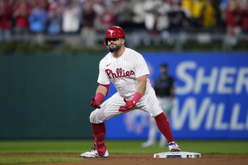Philadelphia Phillies' Kyle Schwarber reacts after hitting a run-scoring double against Miami Marlins pitcher Braxton Garrett during the third inning of Game 2 in an NL wild-card baseball playoff series, Wednesday, Oct. 4, 2023, in Philadelphia. (AP Photo/Matt Slocum)