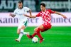 Gladbach's Nico Elvedi, left, and Mainz's Jae-sung Lee fight for the ball during the Bundesliga soccer match between Borussia Monchengladbach and FSV Mainz, at the Borussia-Park stadium in Monchengladbach, Germany, Friday Oct. 6, 2023. (Marius Becker/dpa via AP)
