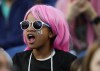 A fan wears a pink wig in honor of OL Reign forward Megan Rapinoe during the first half of an NWSL soccer match between the Reign and the Washington Spirit, Friday, Oct. 6, 2023, in Seattle. (AP Photo/Lindsey Wasson)