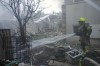 Israeli firefighters extinguish fire after a rocket fired from the Gaza Strip hit a house in Ashkelon, southern Israel, Saturday, Oct. 7, 2023. (AP Photo/Tsafrir Abayov)