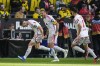 Union's Robin Gosens, left, celebrates after scoring during the German Bundesliga soccer match between Borussia Dortmund and Union Berlin in Dortmund, Germany, Saturday, Oct. 7, 2023. (AP Photo/Martin Meissner)