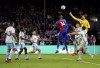 Nottingham Forest goalkeeper Matt Turner, right, punches clear during the English Premier League soccer match between Crystal Palace and Nottingham Forest, at Selhurst Park, London, Saturday, Oct. 7, 2023. (Zac Goodwin/PA via AP)