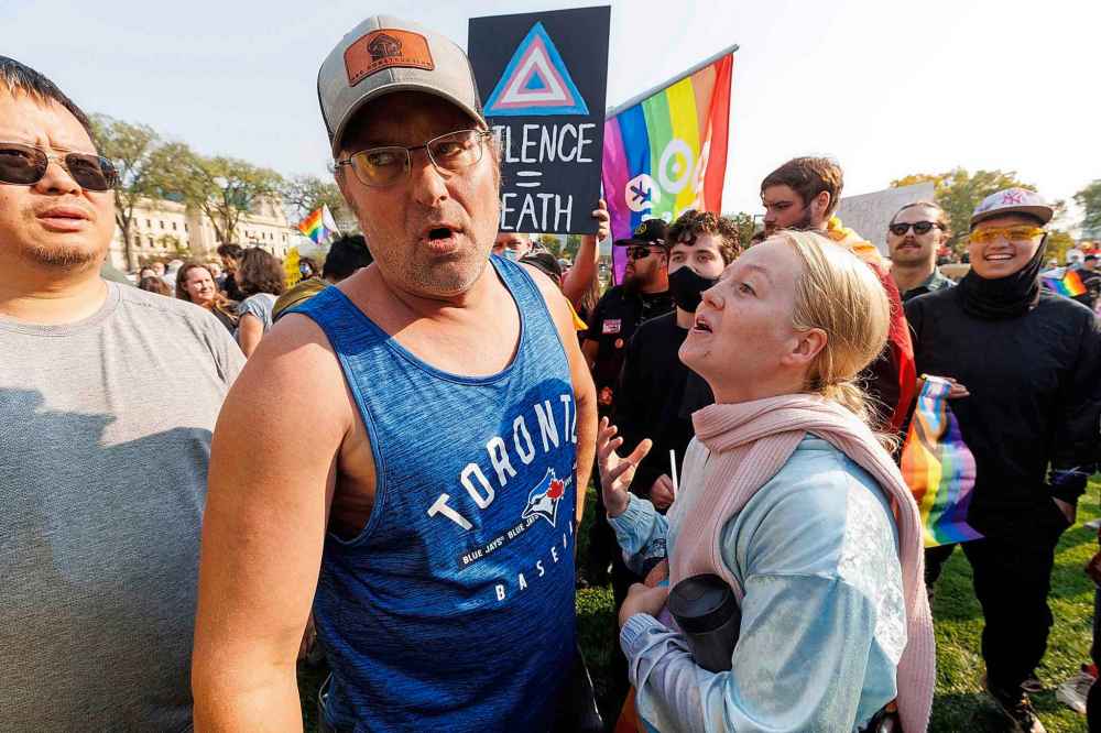 MIKE DEAL / WINNIPEG FREE PRESS
Julia Vincent (right) a member of LGBTQ community and Darrell Shorta, a self described bigot, argue during the protests.