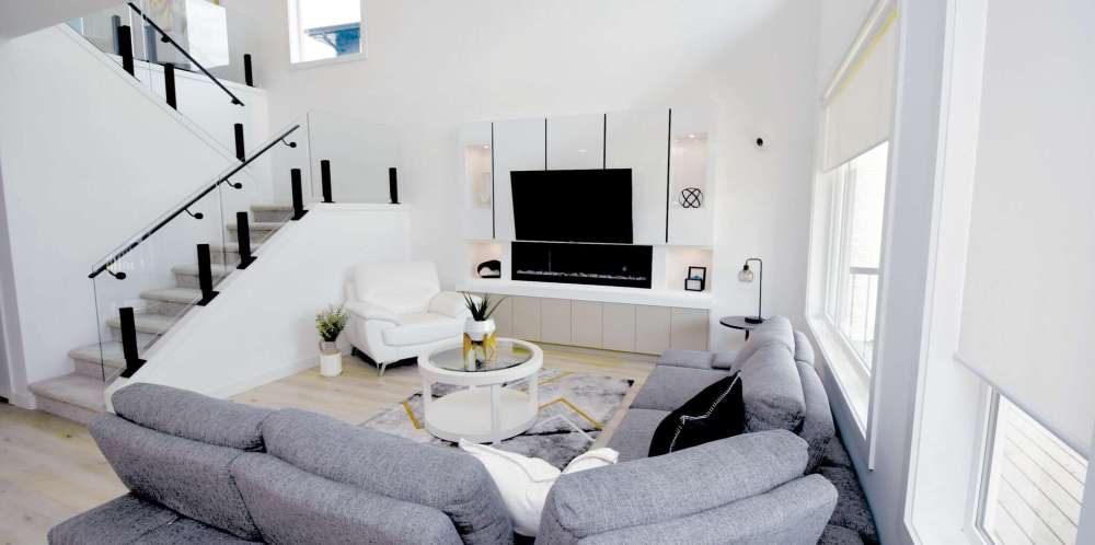 Tempered glass panels allow light to flow more freely between the upper and lower levels.