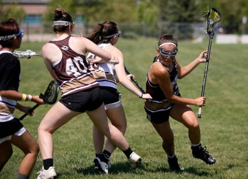 JOHN WOODS / WINNIPEG FREE PRESS
                                Payton Cvetkovic attacks during the female lacrosse day at Shaughnessy Park in May.