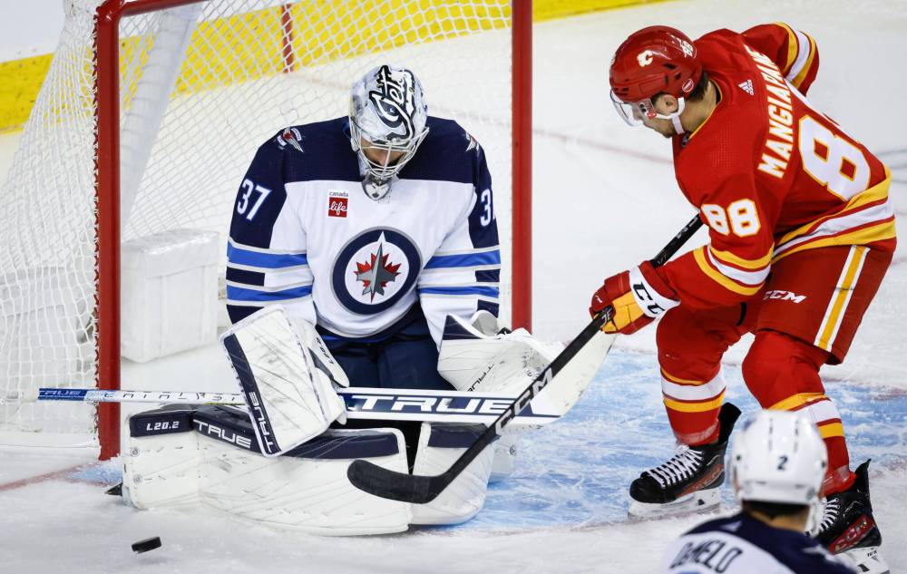 
                                <p>JEFF MCINTOSH / THE CANADIAN PRESS</p>
                                <p>Connor Hellebuyck faced 46 shots against Calgary.</p>