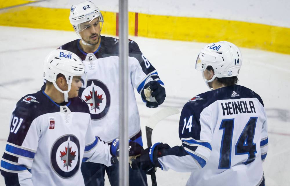 <p>JEFF MCINTOSH / THE CANADIAN PRESS</p>
                                <p>Ville Heinola (right) celebrates his goal with teammates Cole Perfetti (left) and Nino Niederreiter during the first period.</p>