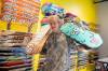 BROOK JONES / WINNIPEG FREE PRESS
                                Fane Smeall, who owns Sk8 Skates with his family, holds a few skateboard decks, while working at the local shop at 564 Main Street.