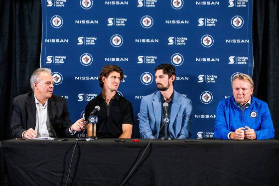 From left: Jets general manger Kevin Cheveldayoff, forward Mark Scheifele, goaltender Connor Hellebuyck, and head coach Rick Bowness at the news conference Tuesday. (Mikaela MacKenzie / Free Press files)