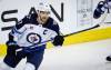 THE CANADIAN PRESS/Jeff McIntosh
                                Winnipeg Jets forward Adam Lowry skates during first period NHL hockey action against the Calgary Flames in Calgary, Wednesday.