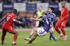 Keito Nakamura, centre, of Japan, scores a goal past Kamal Miller, left, of Canada during a friendly soccer match in Niigata, northern Japan, Friday. (Kyodo News via AP)