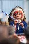 MIKAELA MACKENZIE / WINNIPEG FREE PRESS
                                Wab Kinew lifts a pipe during a chief song at his swearing-in ceremony at The Leaf on Wednesday.