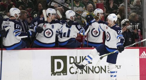 Mason Appleton celebrates after scoring a goal during the third period of an NHL hockey game against the Minnesota Wild in April. (Abbie Parr / The Associated Press files)