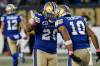 Winnipeg Blue Bombers’ Brady Oliveira (20) and Nic Demski (10) celebrate Oliveira’s touchdown against the Edmonton Elks during first half CFL action in Winnipeg, Saturday, Oct. 21, 2023. (John Woods / The Canadian Press)