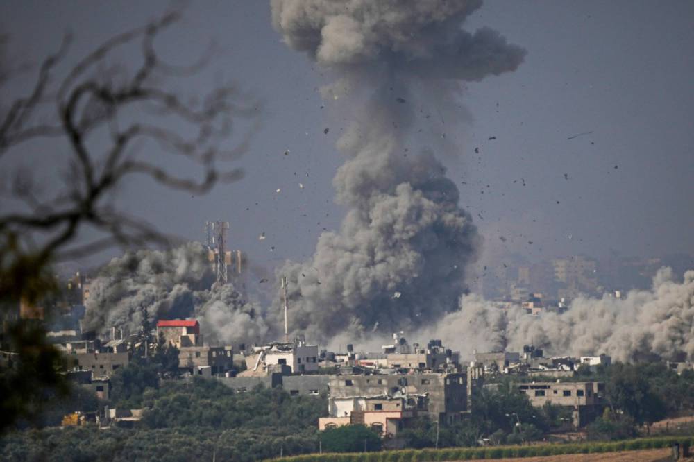 Ariel Schalit / The Associated Press
Smoke rises following an Israeli airstrike in the Gaza Strip, as seen from southern Israel, Monday.