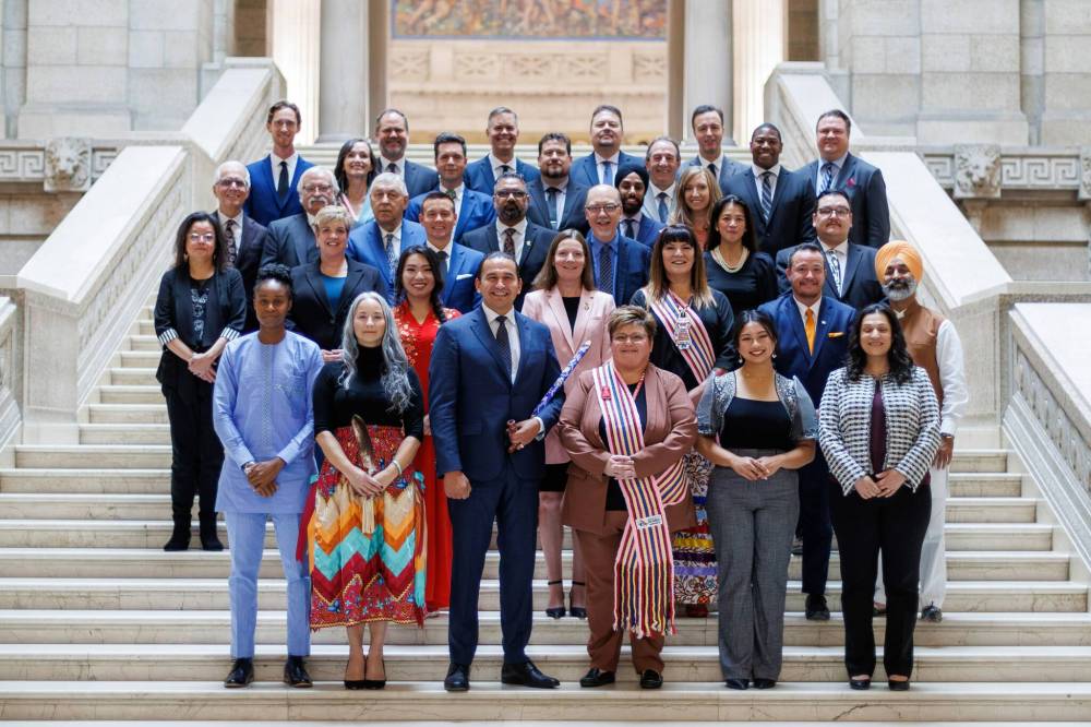 MIKE DEAL / WINNIPEG FREE PRESS
Premier and NDP Leader Wab Kinew and the party's 33 MLAs pose for pictures on the grand staircase at the Manitoba Legislative building after the swearing-in ceremony.