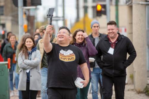 BROOK JONES / WINNIPEG FREE PRESS
                                Carter Chen takes a selfie for his Instagram account as he leads the Chinatown Dim Sum Tour on Saturday.