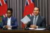 Premier Wab Kinew, right, with Health Minister Uzoma Asagwara (Mike Deal / Winnipeg Free Press)