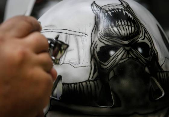 Tony Bage, founder of Wicked Goalie, works on his latest creation in his home studio. (John Woods / Winnipeg Free Press)