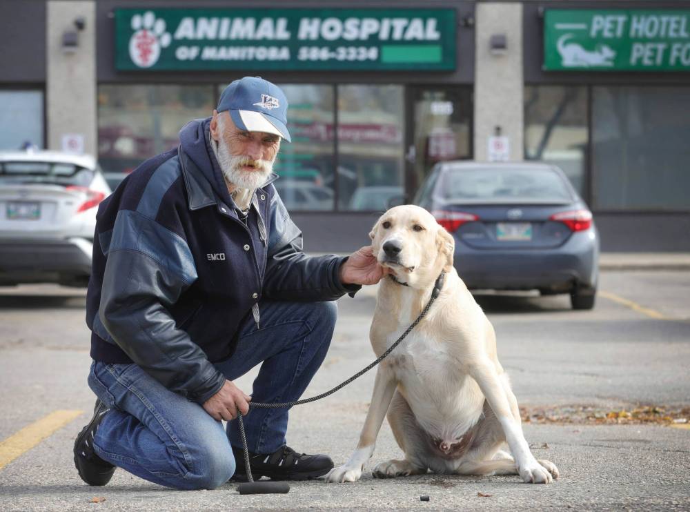 RUTH BONNEVILLE / WINNIPEG FREE PRESS
David Strickland and his dog Chewbacca outside the Animal Hospital which he alleges misdiagnosed his dog with canine parvovirus and presented him with a high estimated bill.