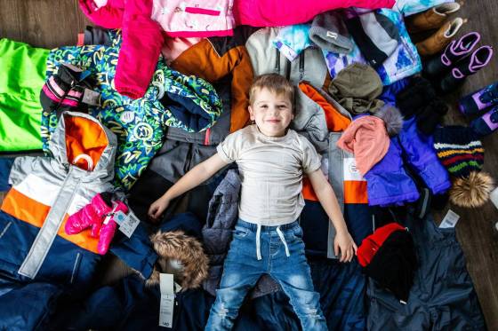 Hudson Lylyk, 5, with some of the snow gear he has collected to provide for Koats for Kids. (Mikaela MacKenzie / Winnipeg Free Press)