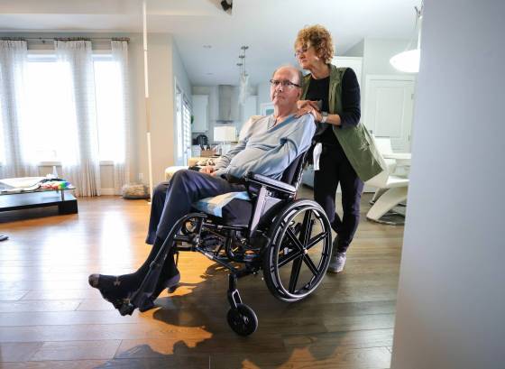 Jean Marcoux and his wife, Gisele. Before the portable lift, Marcoux said he was stuck for 12 hours or more in his wheelchair or in his bed. (Ruth Bonneville / Winnipeg Free Press)