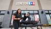 RUTH BONNEVILLE / WINNIPEG FREE PRESS
                                StretchLab’s general manager Shelly Rabang, with owner, Josh Odwak getting a stretched out by Lead Flexologist, Joseph Yumang, in front of StretchLab’s Winnipeg location on Sterling Lyon Parkway which is still under renovation but will be open in November.