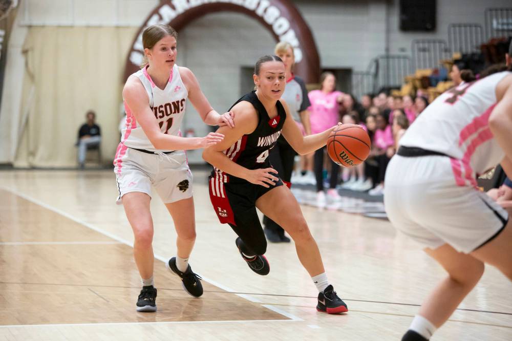 BROOK JONES / WINNIPEG FREE PRESS
                                U of W’s Tana Layton is guarded by Bisons forward Emily Johnson Friday night at Investors Group Athletic Centre.