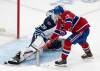 CHRISTINNE MUSCHI / THE CANADIAN PRESS
                                Canadiens’ Nick Suzuki scores the winning goal in a shootout against Jets goaltender Laurent Brossoit in Montreal Saturday night.