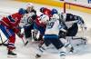 Winnipeg Jets goaltender Laurent Brossoit (39) makes a save against Montreal Canadiens’ Brendan Gallagher (11) during second period NHL hockey action in Montreal on Saturday, Oct. 28, 2023. (Christinne Muschi / The Canadian Press)