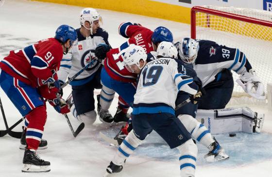 Winnipeg Jets goaltender Laurent Brossoit (39) makes a save against Montreal Canadiens' Brendan Gallagher (11)  on Saturday. (Christinne Muschi / The Canadian Press files)