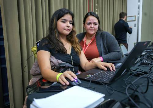 RUTH BONNEVILLE / WINNIPEG FREE PRESS
                                Desjarlais shows one of her designs to her teacher, Vanessa Lathlin.