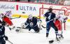 JOHN WOODS / WINNIPEG FREE PRESS
                                New York Rangers’ Artemi Panarin scores on Winnipeg Jets goaltender Connor Hellebuyck during the first period in Winnipeg on Monday.