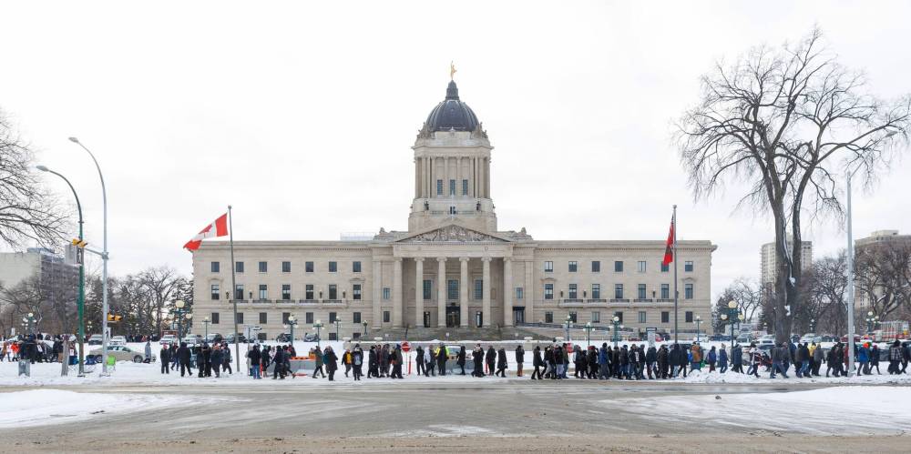As close to 900 workers walked a picket line outside the Manitoba Legislative Building Tuesday morning, an unknown man physically attacked three members of the Manitoba Government and General Employees’ Union, an MGEU spokesperson said. (Mike Deal / Winnipeg Free Press)