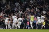 Players of Tottenham celebrate after Liverpool's Joel Matip scored an own goal during the English Premier League soccer match between Tottenham Hotspur and Liverpool at the Tottenham Hotspur Stadium, in London, England, Saturday, Sept. 30, 2023. (AP Photo/Alberto Pezzali)