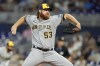 Milwaukee Brewers starting pitcher Brandon Woodruff throws during the first inning of a baseball game against the Miami Marlins, Saturday, Sept. 23, 2023, in Miami. (AP Photo/Lynne Sladky)