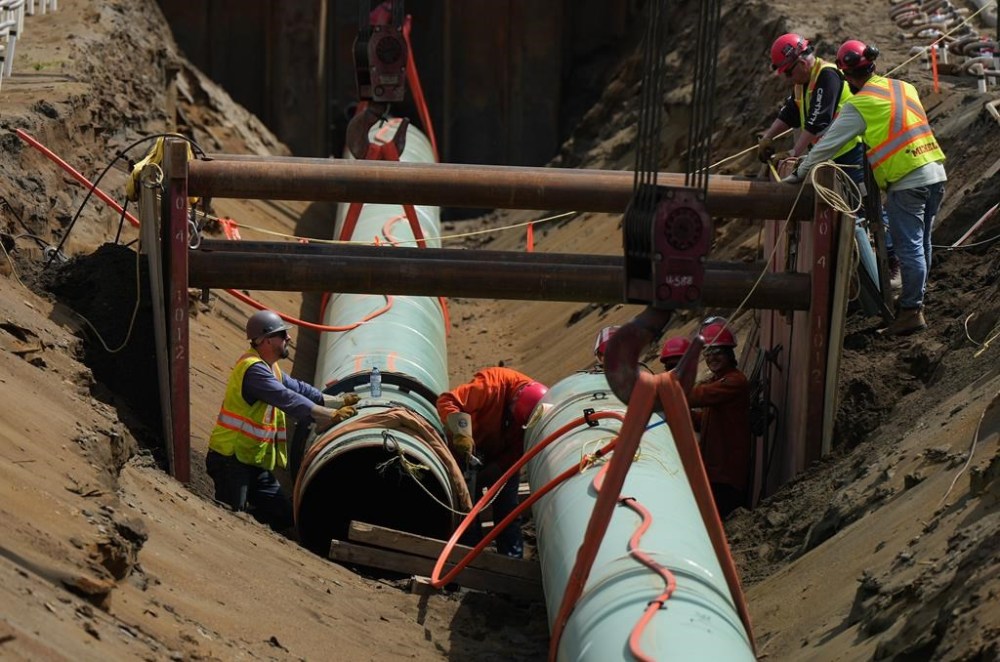 Construction on the Trans Mountain pipeline near Pípsell, or Jacko Lake, near Kamloops, B.C., resumed after the Canada Energy Regulator allowed for the company to alter the pipeline route. Workers lay pipe during construction of the Trans Mountain pipeline expansion on farmland, in Abbotsford, B.C., on Wednesday, May 3, 2023. THE CANADIAN PRESS/Darryl Dyck