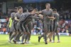 Tottenham Hotspur's Micky van de Ven, right is congratulated by teammates after the final whistle of the English Premier League soccer match between Luton Town and Tottenham Hotspur, at Kenilworth Road, in Luton, England, Saturday, Oct. 7, 2023. (Bradley Collyer/PA via AP)