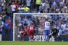 Liverpool's Mohamed Salah scores on a penalty kick during the Premier League soccer match between Brighton and Hove Albion and Liverpool at the American Express Community Stadium in Brighton, England, Sunday, Oct. 8, 2023. (AP Photo/Alberto Pezzali)